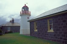 The lighthouse tower with the quarters on the left and signal station on the right