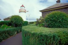 The lighthouse tower with the quarters on the right and signal station on the left